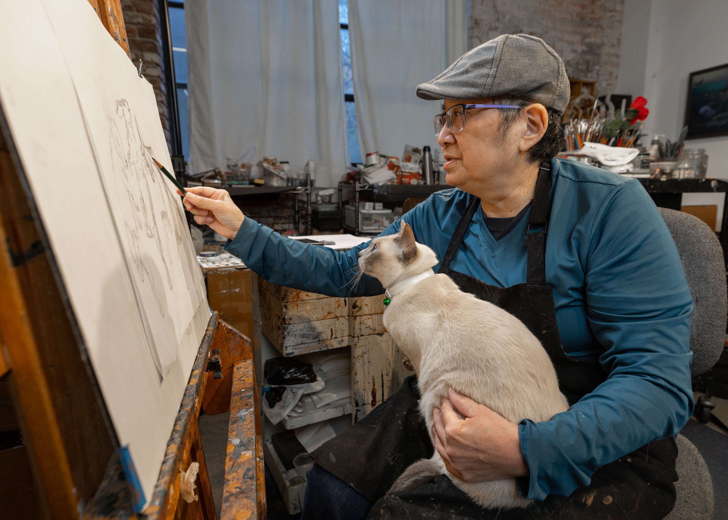 asian-woman-artist-drawing-in-studio-with-her-cat-1312