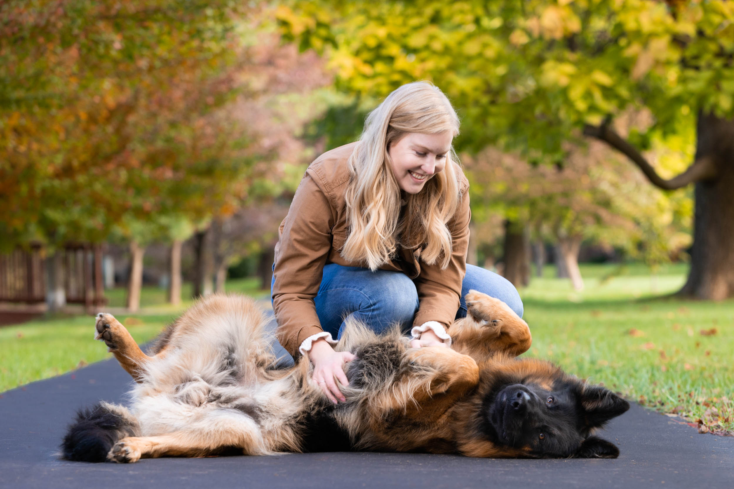 Pet Lifestyle Photography | Woman Petting Dog on its Back by Mark Rogers