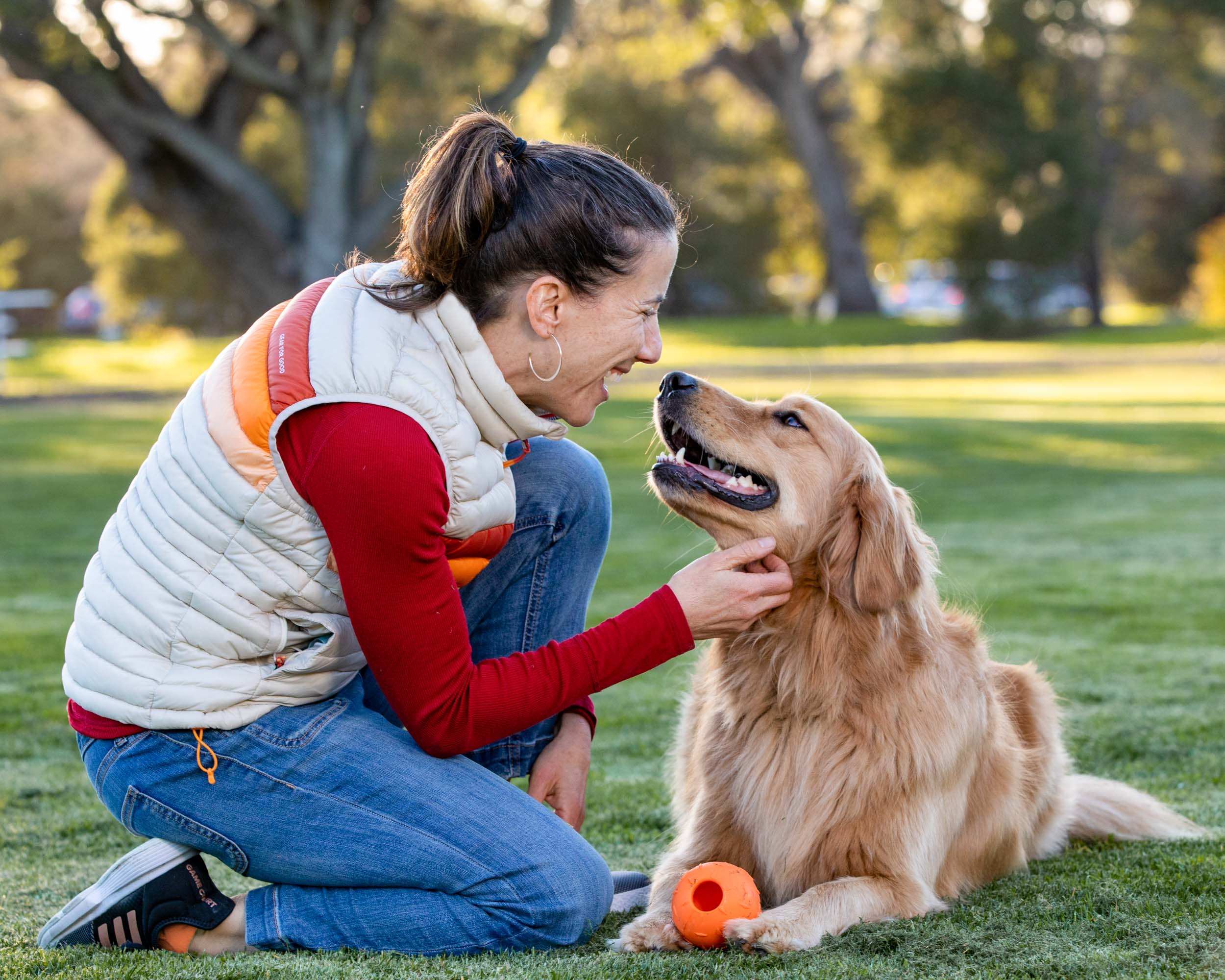 Pet and People Photography | Woman Petting Her Dog in Park by Mark Rogers