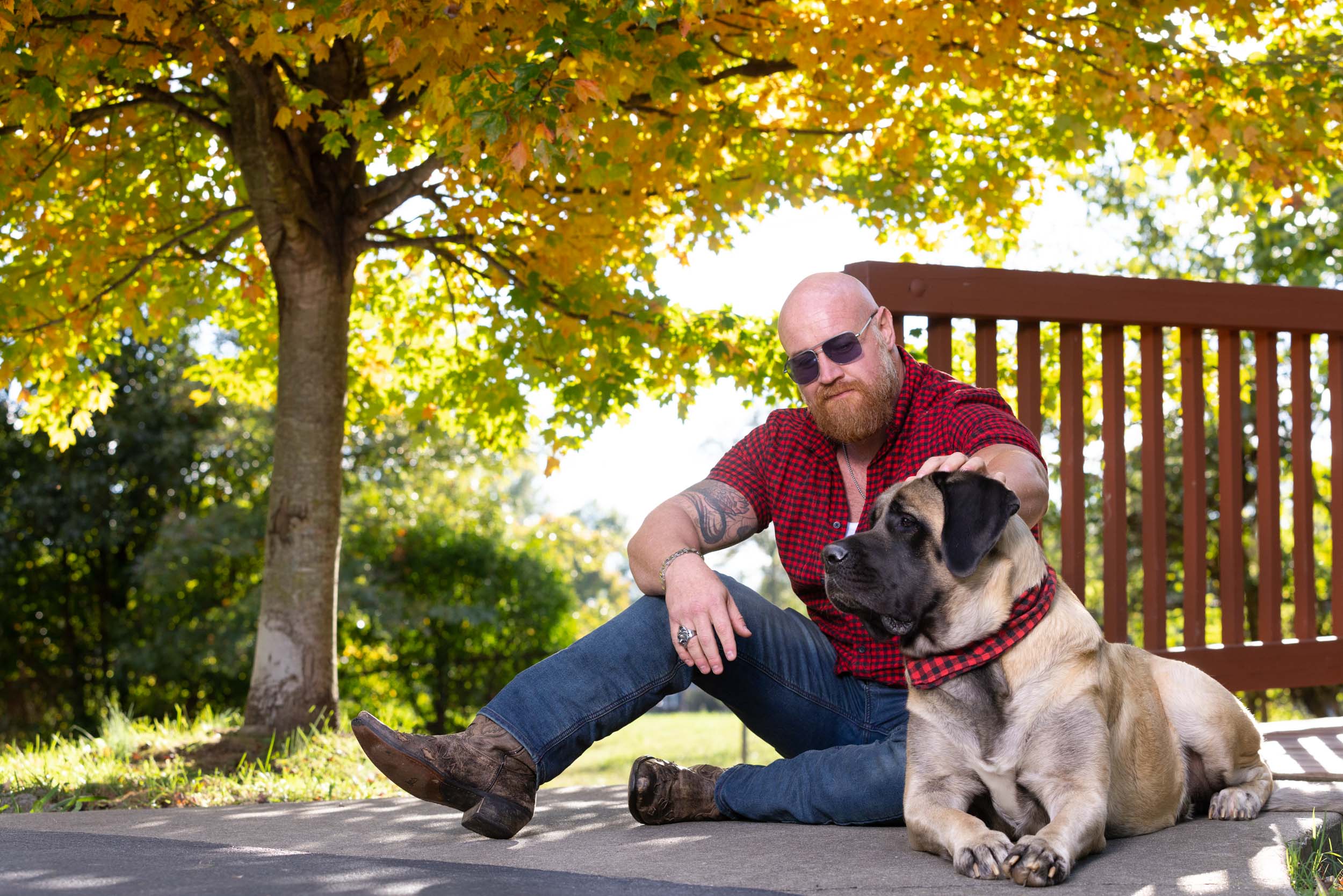 Dog Lifestyle Photography | Large Man and Big Dog Sitting at Bridge