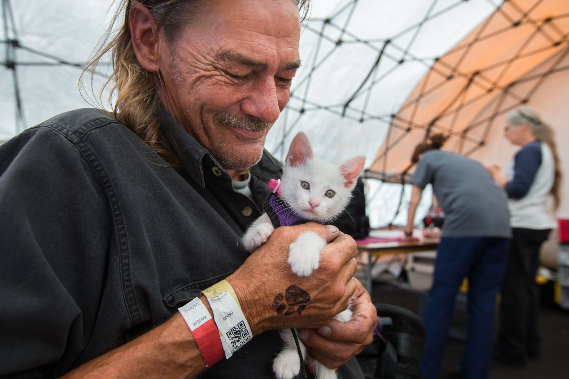 Editorial Photography | Homeless Man Holding Kitten by Mark Rogers