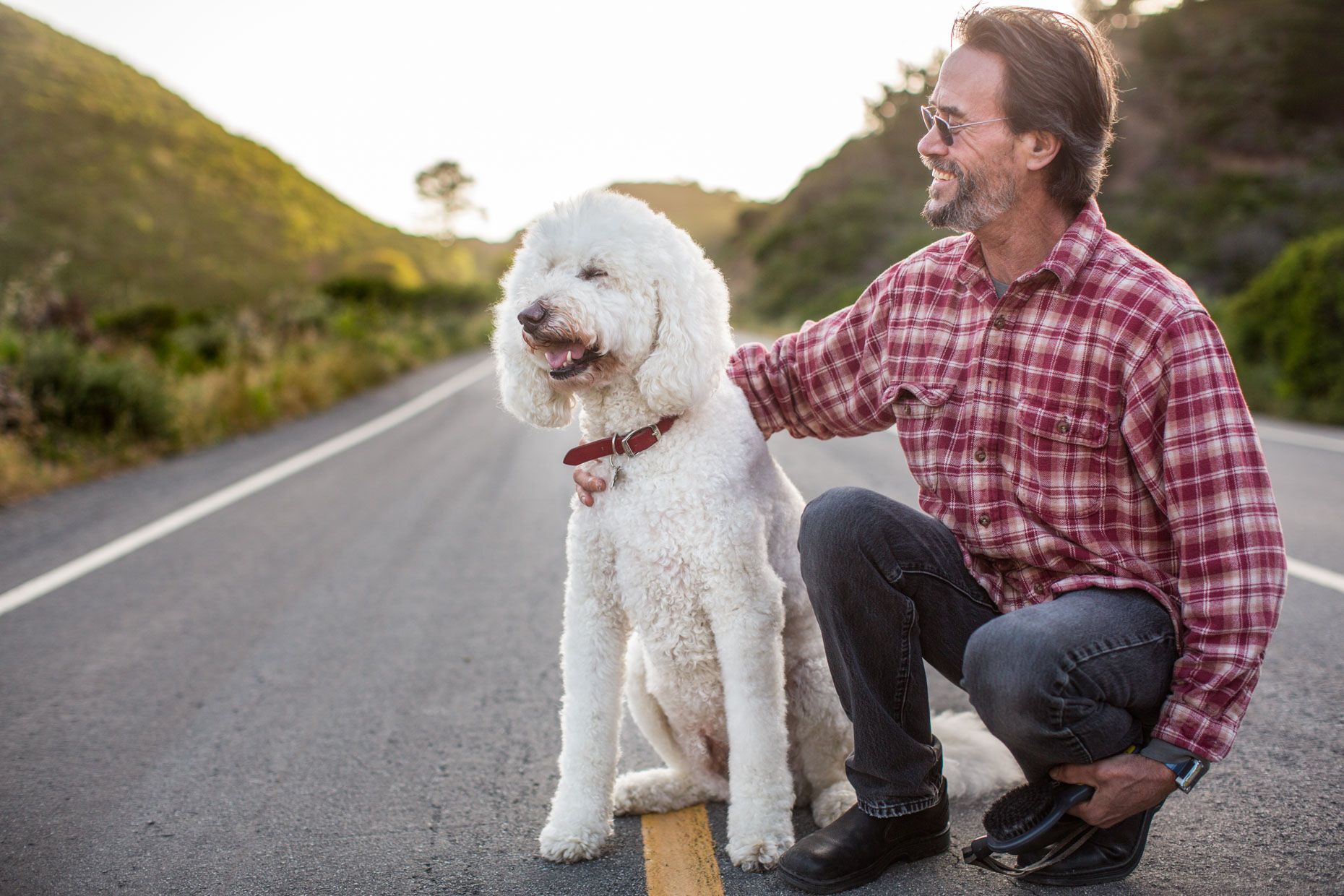 Commercial Photography | Man Laughing with Poodle by Mark Rogers